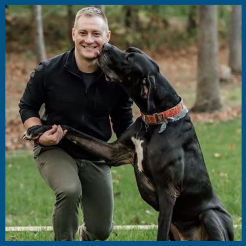 a 5x5 blue border with Dr. Fisher and his Great Dane outside