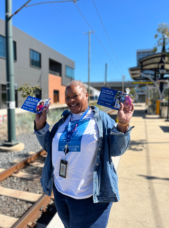 CATS representative handing out flyers for try transit week