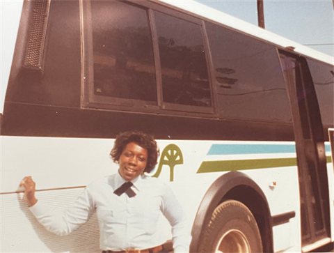 Brenda Moore posing in front of CATS bus