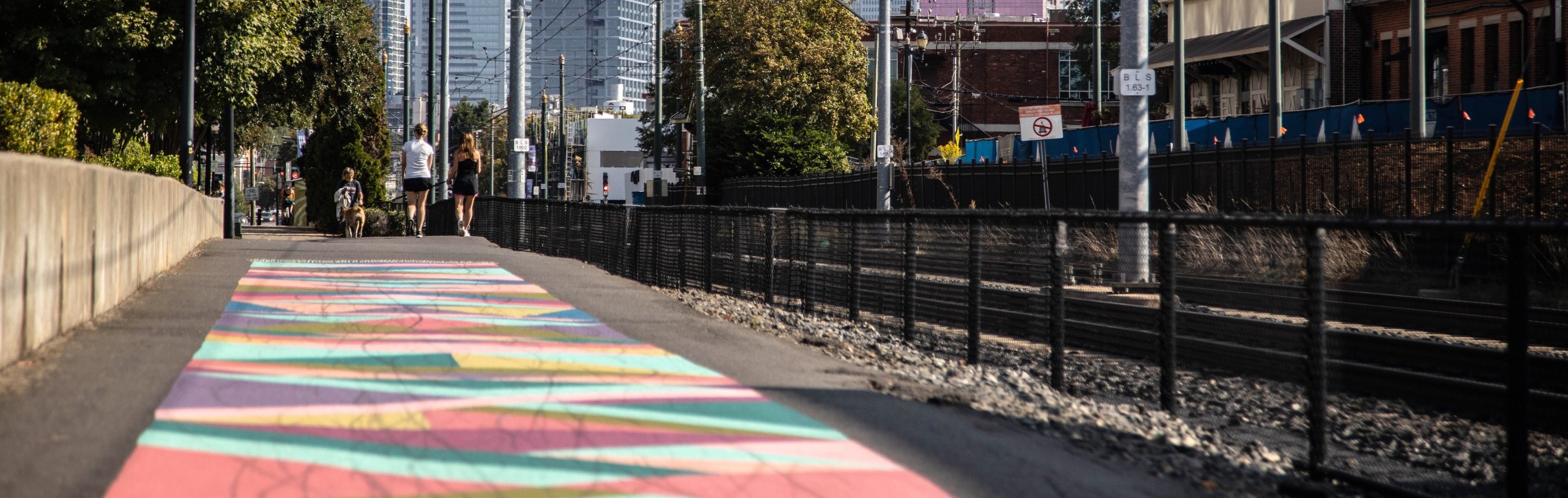 Art mural on the side walk near the rail in south end