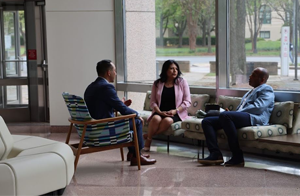 Three people conversing