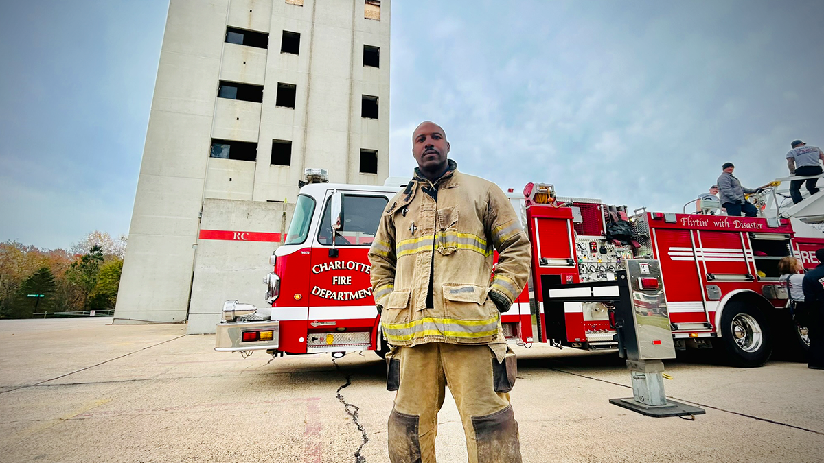 In his fire gear, Captain Andre Fuller showcases the dual roles of strength and empathy that define his career. His efforts to support mental health awareness have changed the way first responders approach crises. 