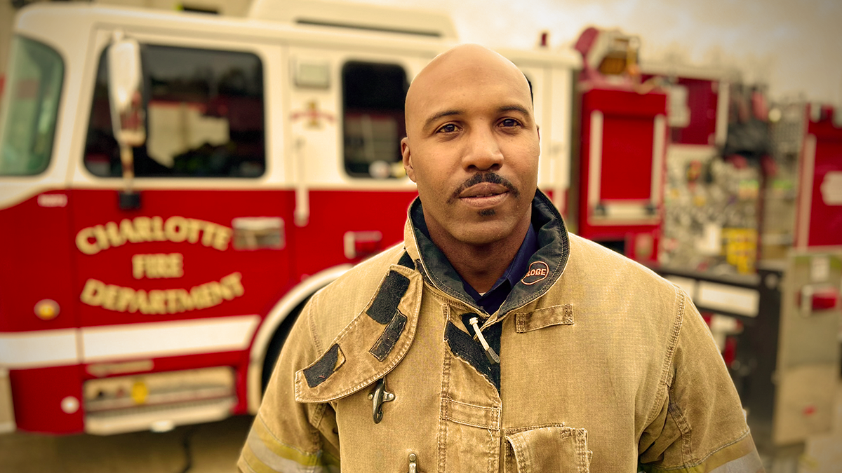 Captain Fuller stands ready at the training academy, representing the dedication required to excel in the fire service. His focus on mental health intervention has set a new standard for compassionate leadership in Charlotte Fire. 