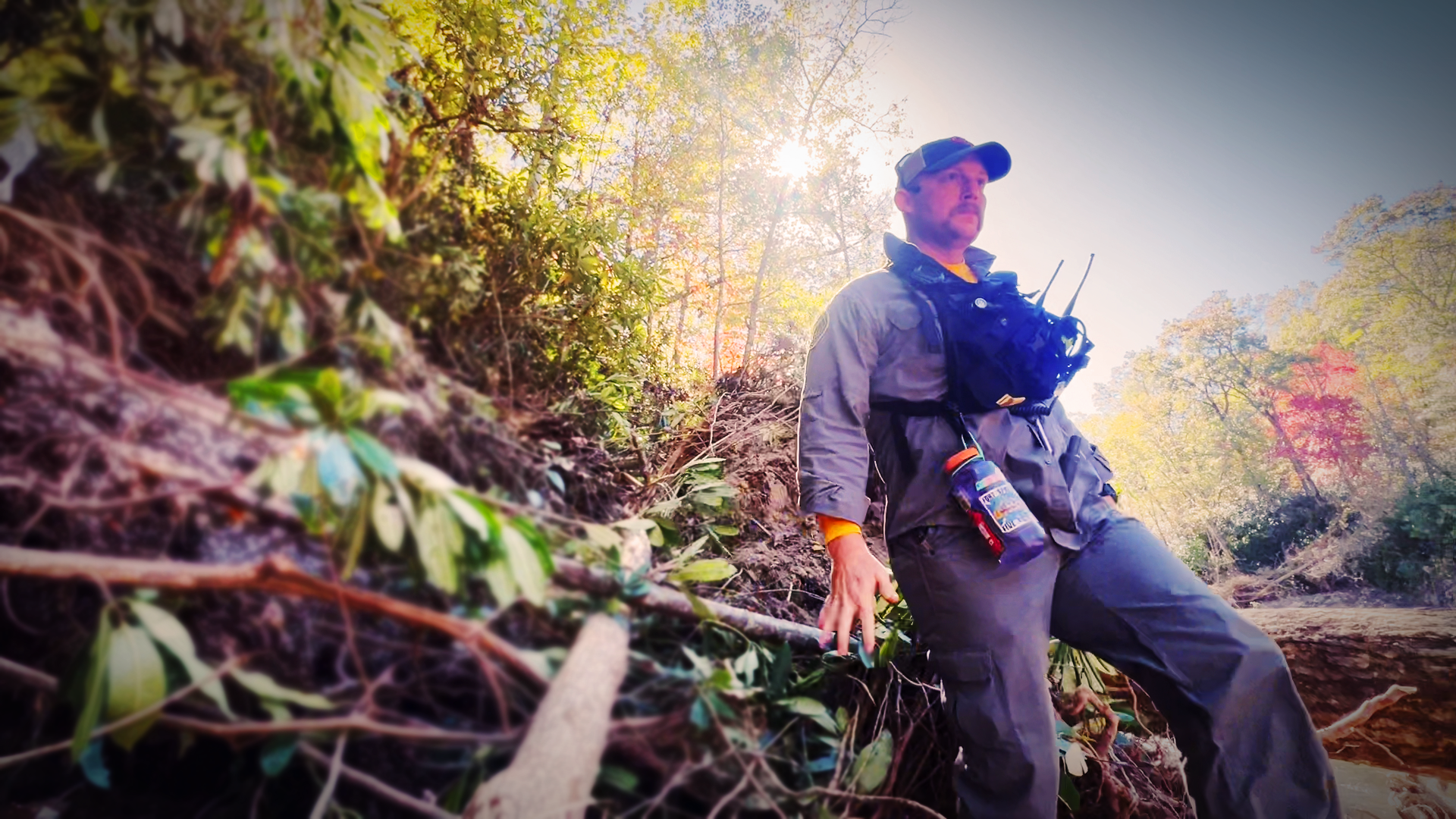 carefully navigates challenging terrain during a search operation in Yancey County as part of the Hurricane Helene recovery effort.