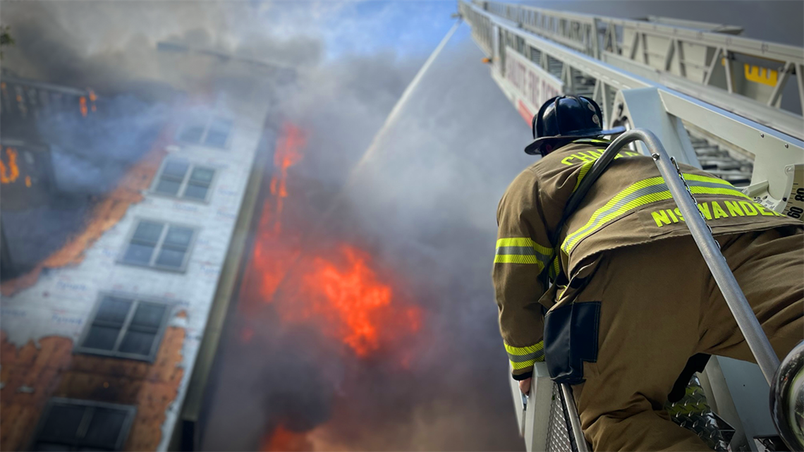 Charlotte Fire Engineer Levi Niswander directs a powerful water stream into a raging 5-alarm fire on Liberty Row Rd., captured on May 18, 2023. His focus and skill exemplify the bravery and expertise of Charlotte Fire's frontline heroes. 