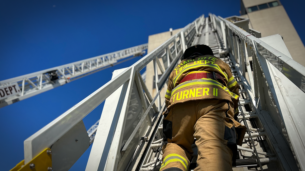 Recruit Blain Turner tackles a ladder drill, embodying the discipline and focus that firefighting demands. 