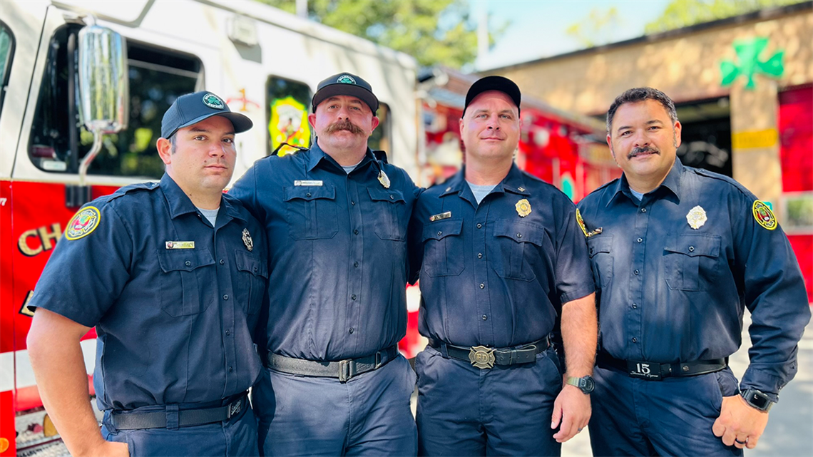 The Engine 15 crew, from left to right: Jonathan Moore, William Costello, Nathan Jones, and Justin Barringer, stand together in front of their station after their heroic actions during one of the most dangerous calls in Charlotte’s history. 