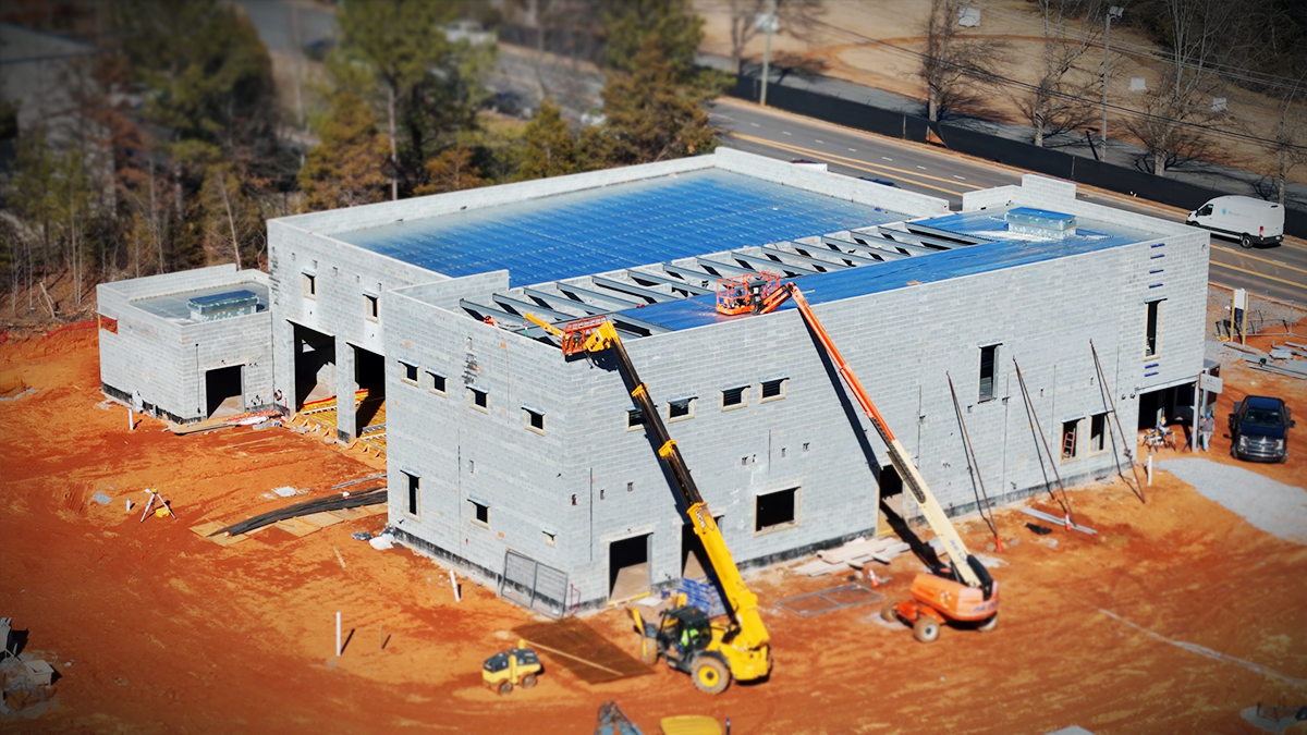 An overview of the main building structure, highlighting the firehouse’s spacious layout and multiple bays. 