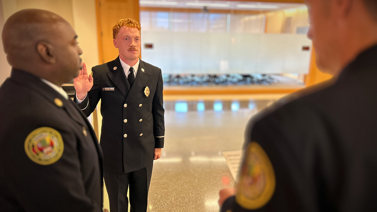 Gabriel Howard takes the firefighter’s oath, pledging to serve the community with honor and integrity. This solemn moment at Charlotte Fire Headquarters marks the beginning of his new chapter as a firefighter. 