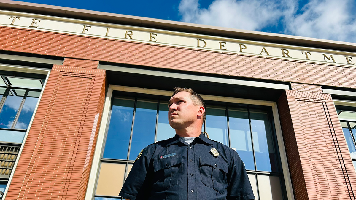 Anderson at the Charlotte Fire Headquarters, where his commitment to his role and his crew is visibly evident. 