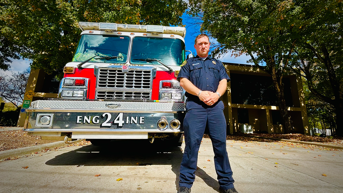 Capturing Anderson with his station in the background, a reminder of the sacrifices made by firefighters each day. 