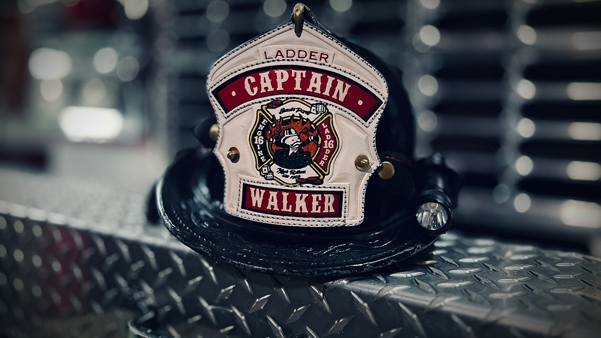 The helmet of Captain Matthew Walker, proudly displaying his name and station, symbolizes his dedication to Charlotte Fire and his team.