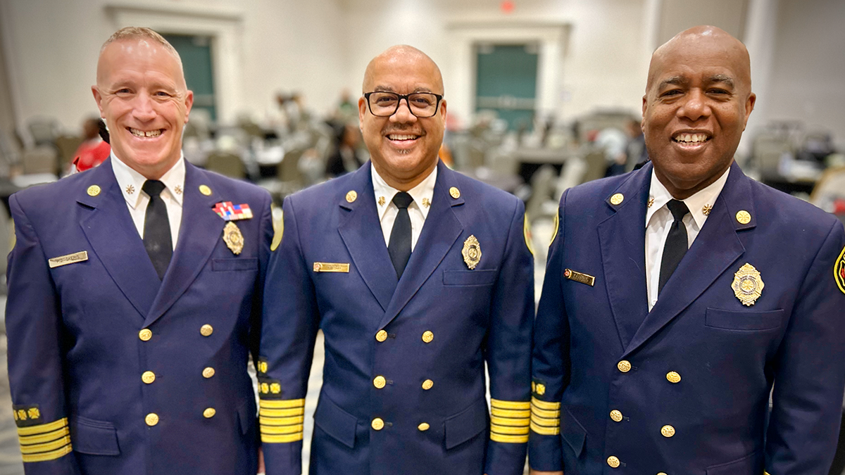 Group photo: Deputy Chief Pete Skeris (left), Fire Chief Reginald Johnson (center, and Deputy Chief Samuel Jones (right)