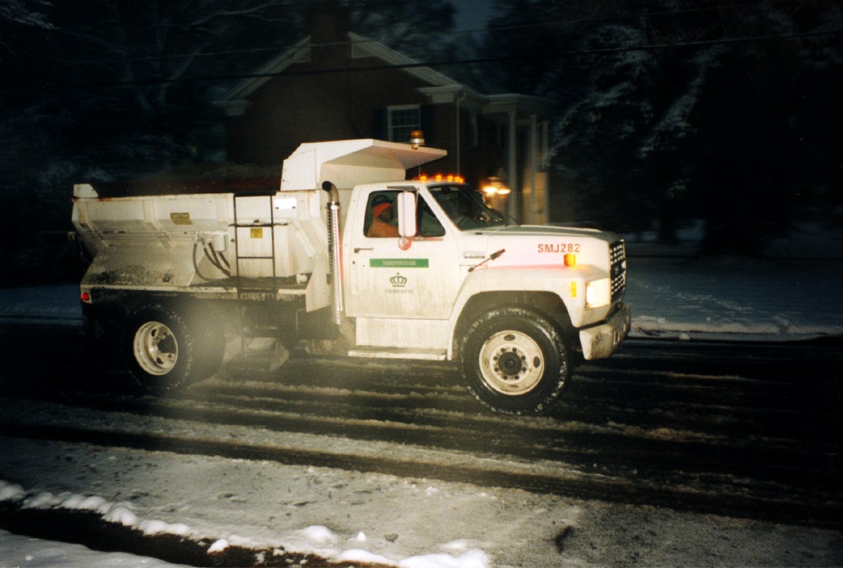 White truck with City of Charlotte Crown logo and the word 