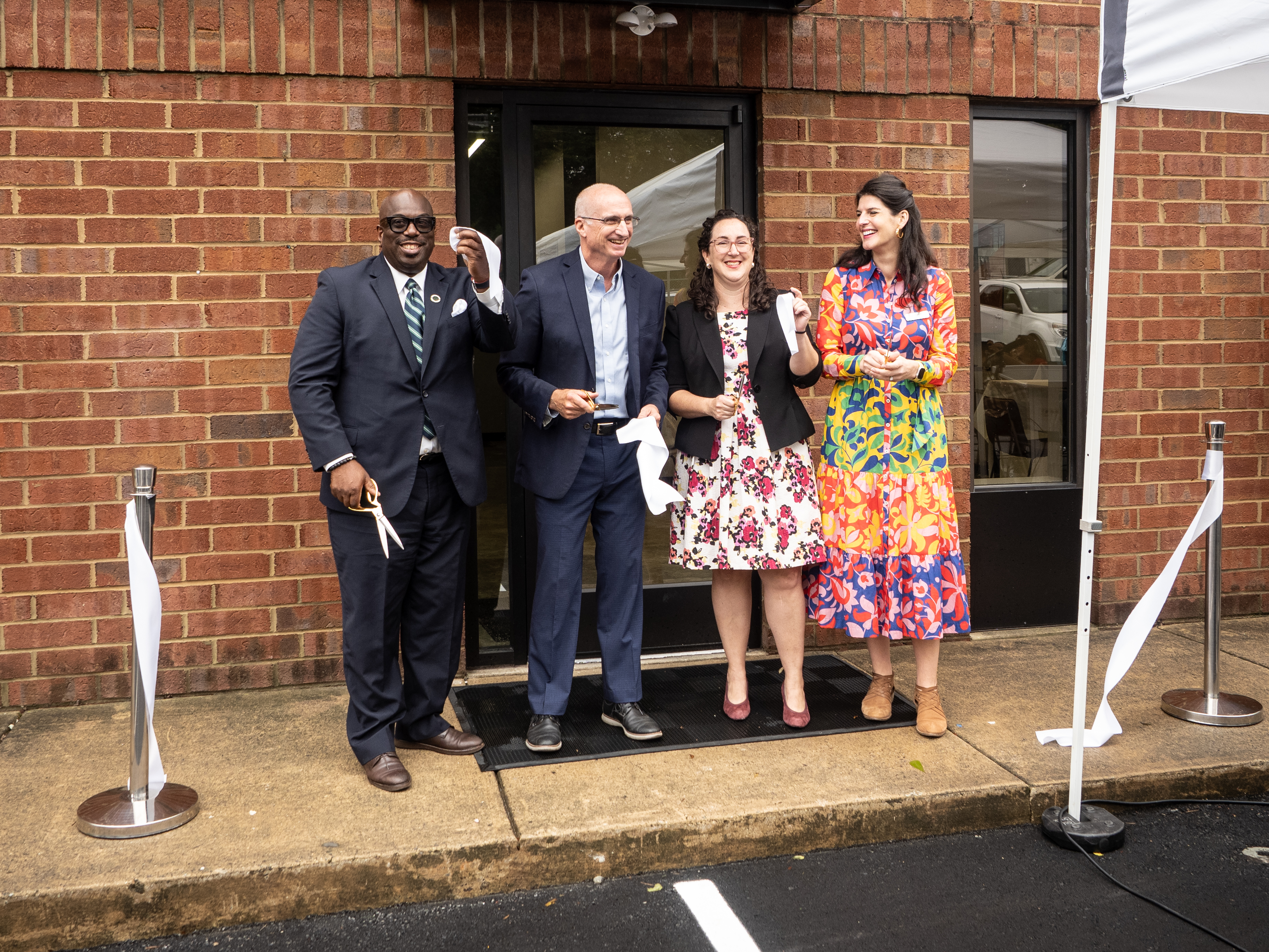 City employees and partners cut the ribbon at the opening of the Freedom Business Collective.