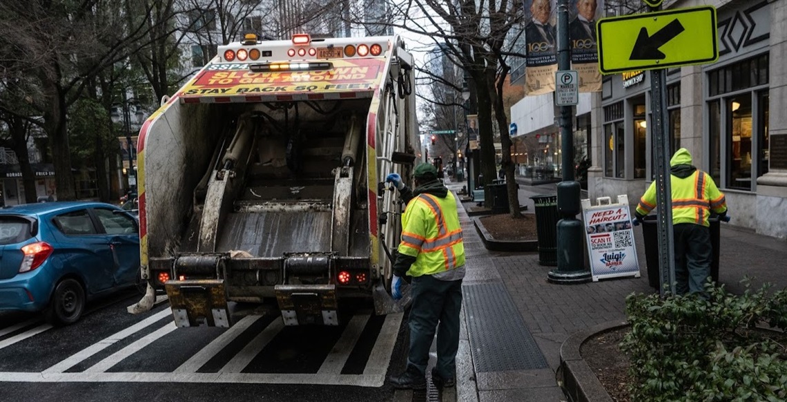 SWS workers collect trash in Uptown Charlotte.