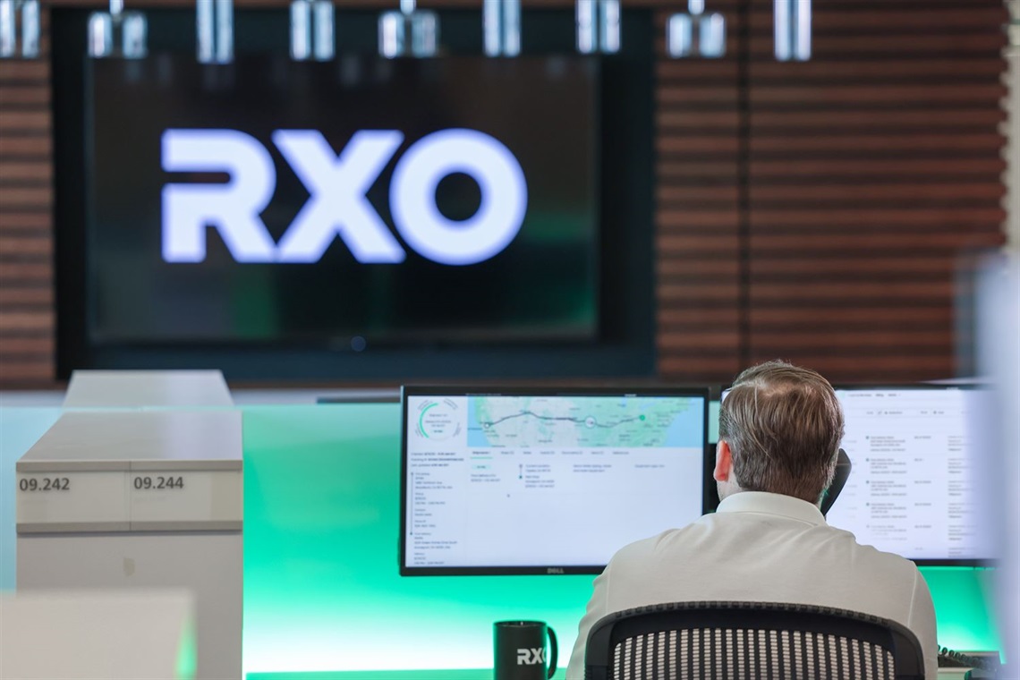 A man works at a computer in the RXO Charlotte office.