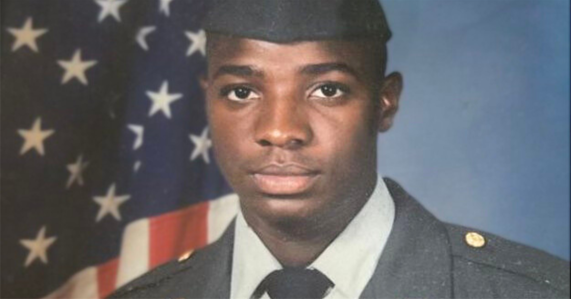 Close up of Silvester Fulmore, U.S. Army Veteran, in uniform for a professional photo. He is posed in front of the American flag.