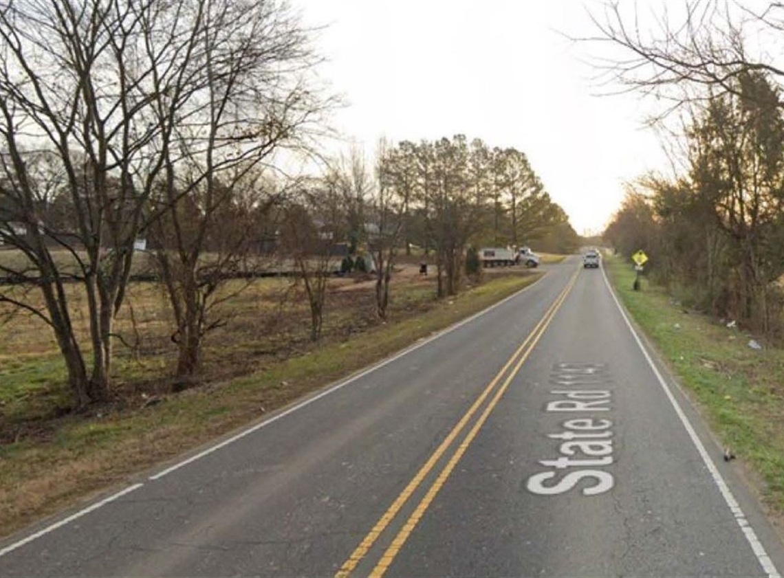 a view of Brown-Grier Road before improvements -- a two lane road with no sidewalks or other infrastructure