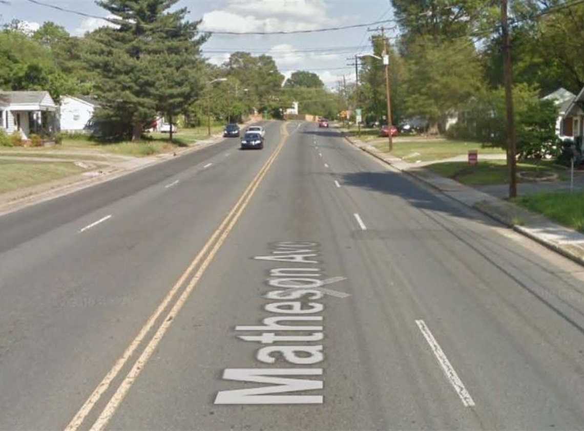 a photograph from GoogleMaps of the existing roadway with two lanes in each direction and sidewalk with no planting strip